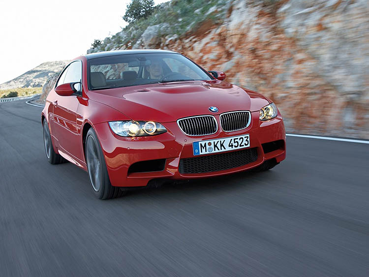 red bmw m3 rolling tracking shot
